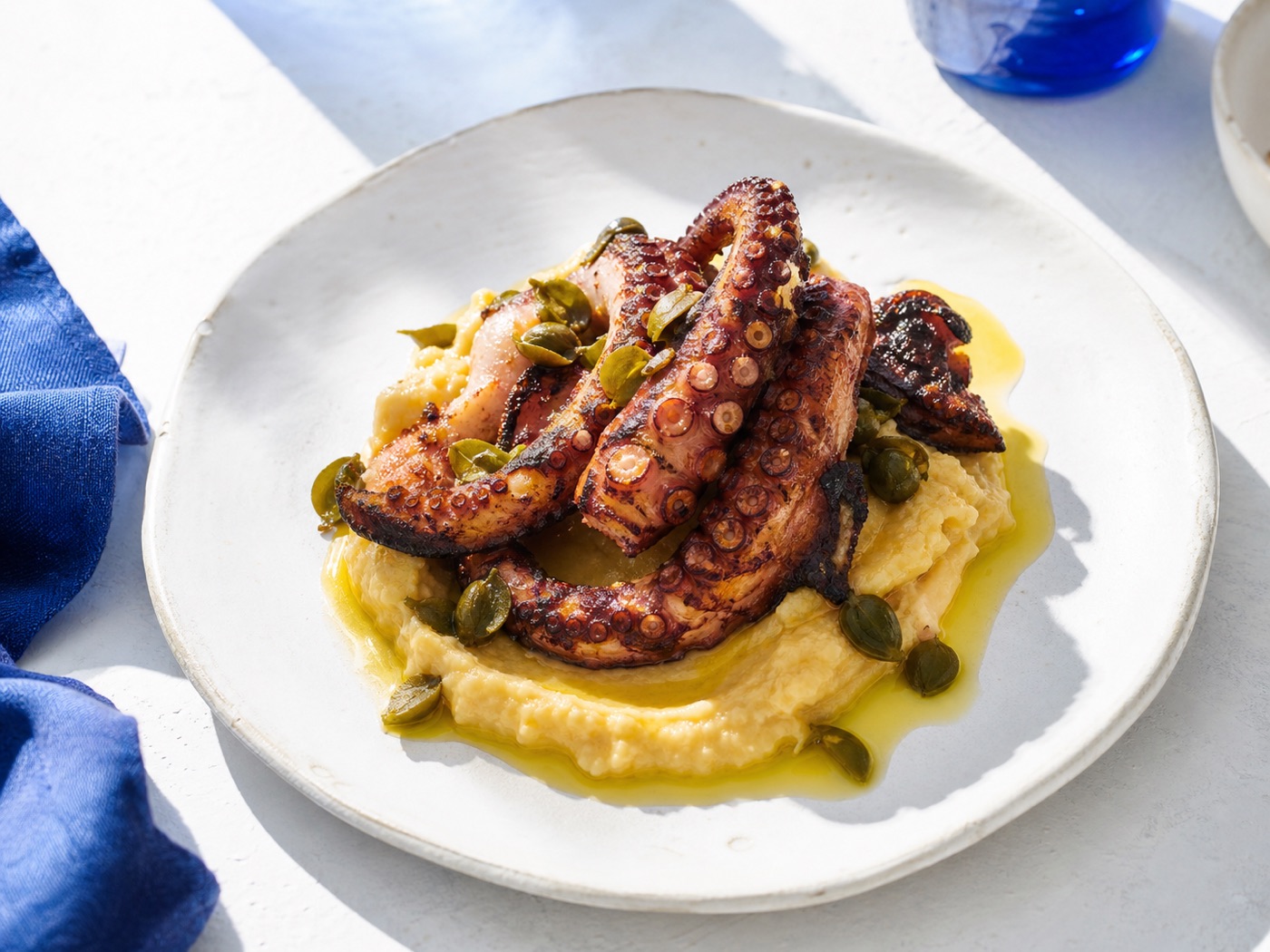 Plate of charred octopus and fava