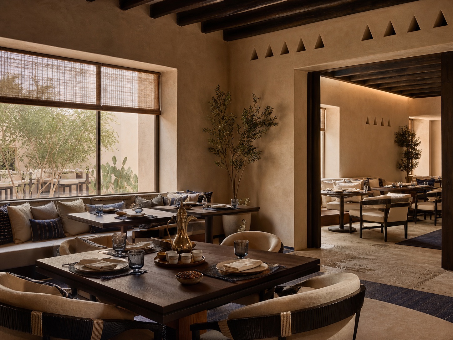 Clay and indigo dining room with a long shared table