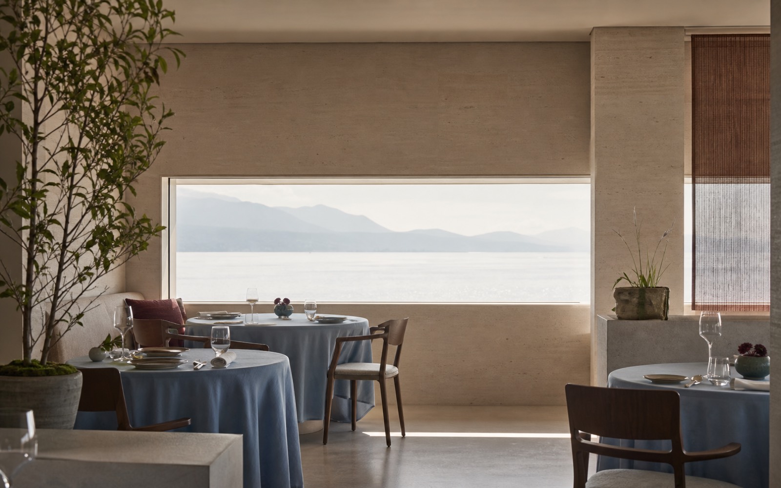 Lake-lit dining room facing Lausanne waterfront