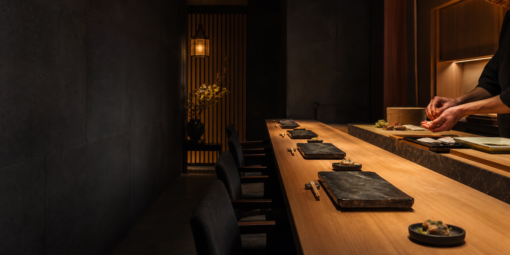 Quiet omakase counter set for an evening meal